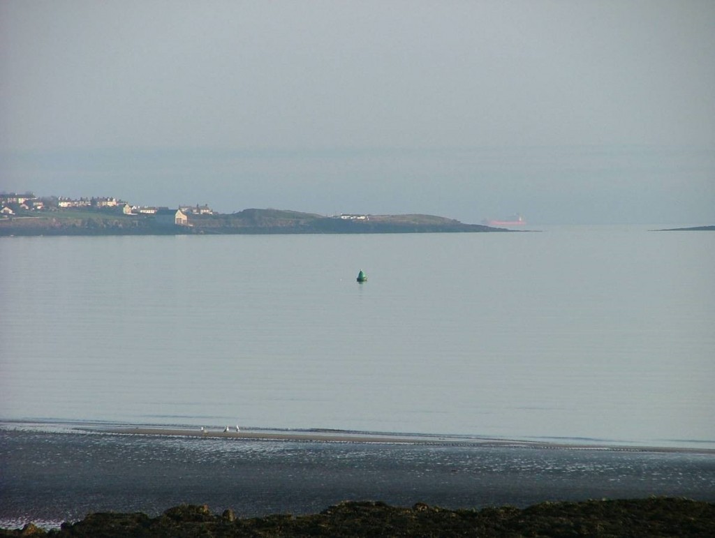 Flat calm on Red Wharf Bay